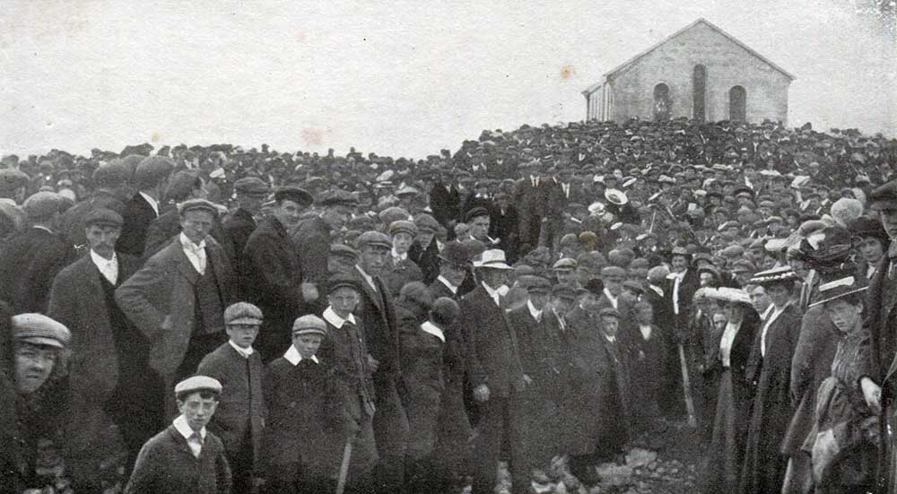 Pilgrims surrounding the Oratory on the summit of Crough Patrick